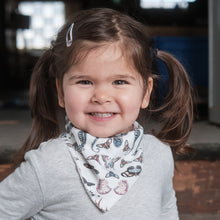Load image into Gallery viewer, girl with pigtails wearing white printed jersey bib