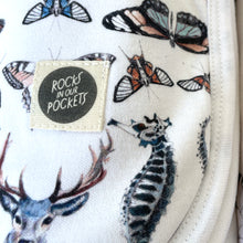 Load image into Gallery viewer, closeup offolded jersey baby blanket in gender neutral shell print