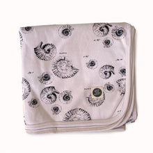 Load image into Gallery viewer, folded jersey baby blanket, swaddle blanket or stroller blanket in gender neutral shell print