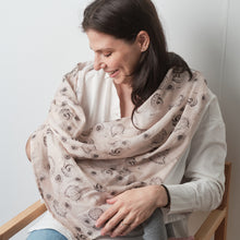 Load image into Gallery viewer, mom using our printed muslin swaddle as a breastfeeding cover / nursing cover