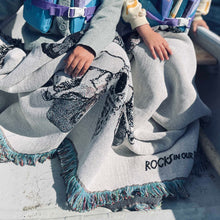 Load image into Gallery viewer, two children out-and-about in a canoe with moth print luxury recycled cotton throw blanket