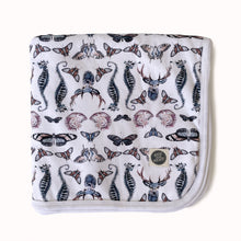 Load image into Gallery viewer, folded jersey baby blanket in gender neutral butterfly deer and shell print
